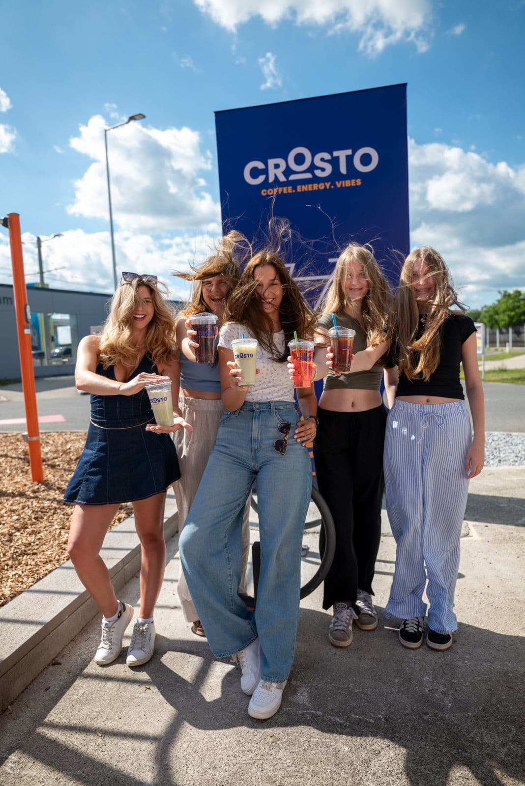 5 Girls before Crosto Sign with Crosto Drinks